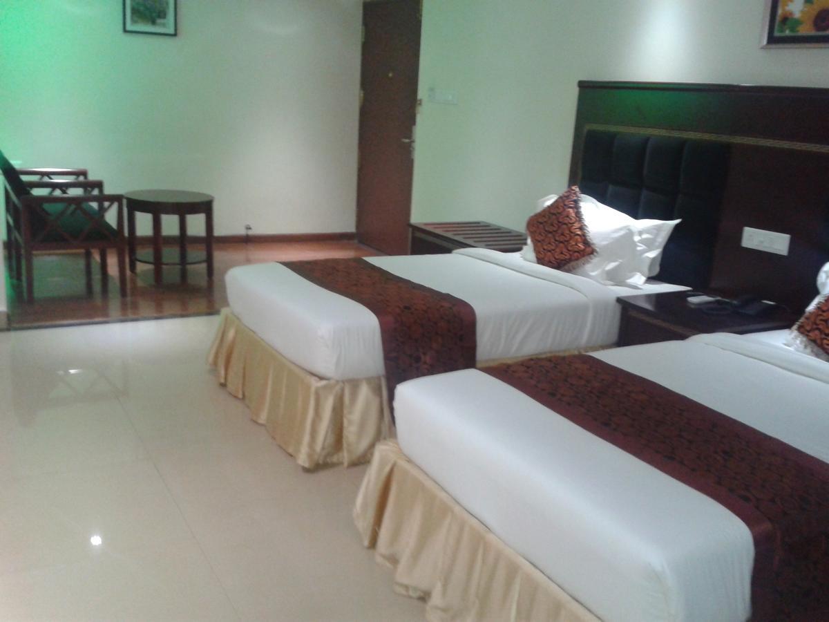 Hotel Hiton Perintalmanna Habitación foto