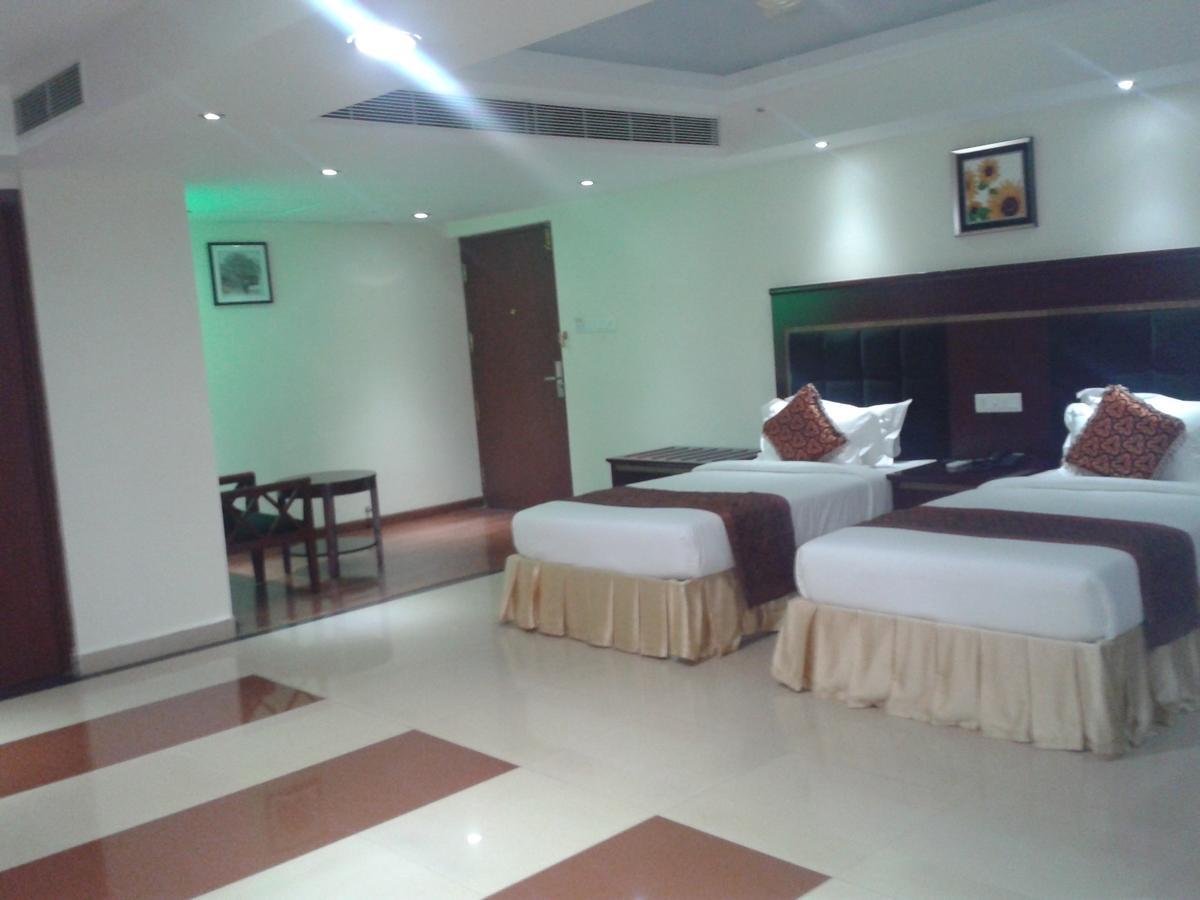 Hotel Hiton Perintalmanna Habitación foto
